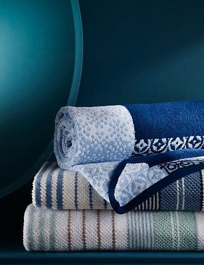 Soft premium terry cotton bath towels in white and earth tones